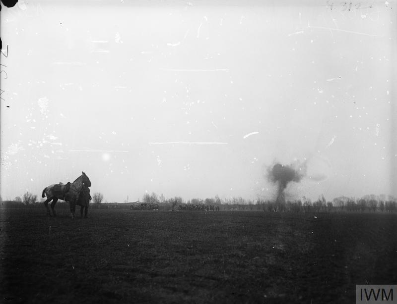 IWM (Q 10877) Battle of Estaires. German shell bursting in distance, 10 April 1918