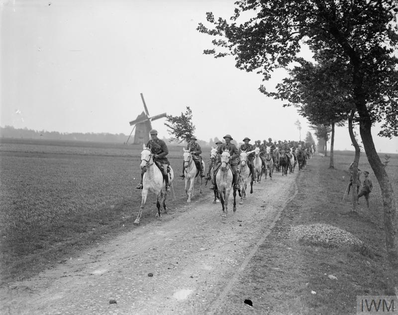 IWM (Q 8952) Royal Scots Greys riding their horses on a road at Brimeux, 25 May 1918
