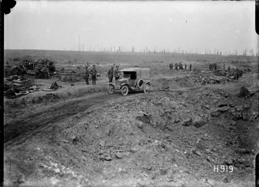 nlnzimage 1-2 013495-G Motor car passing a huge shell hole in captured ground, Grevillers, 24 Aug 1918