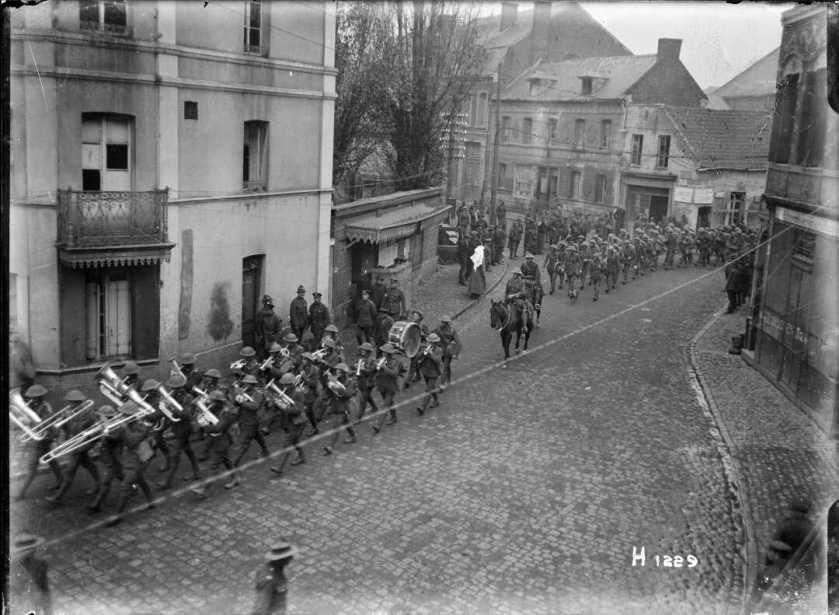 nlnzimage 12-013776-G NZ Troops parading Solesmes, late Nov 1918